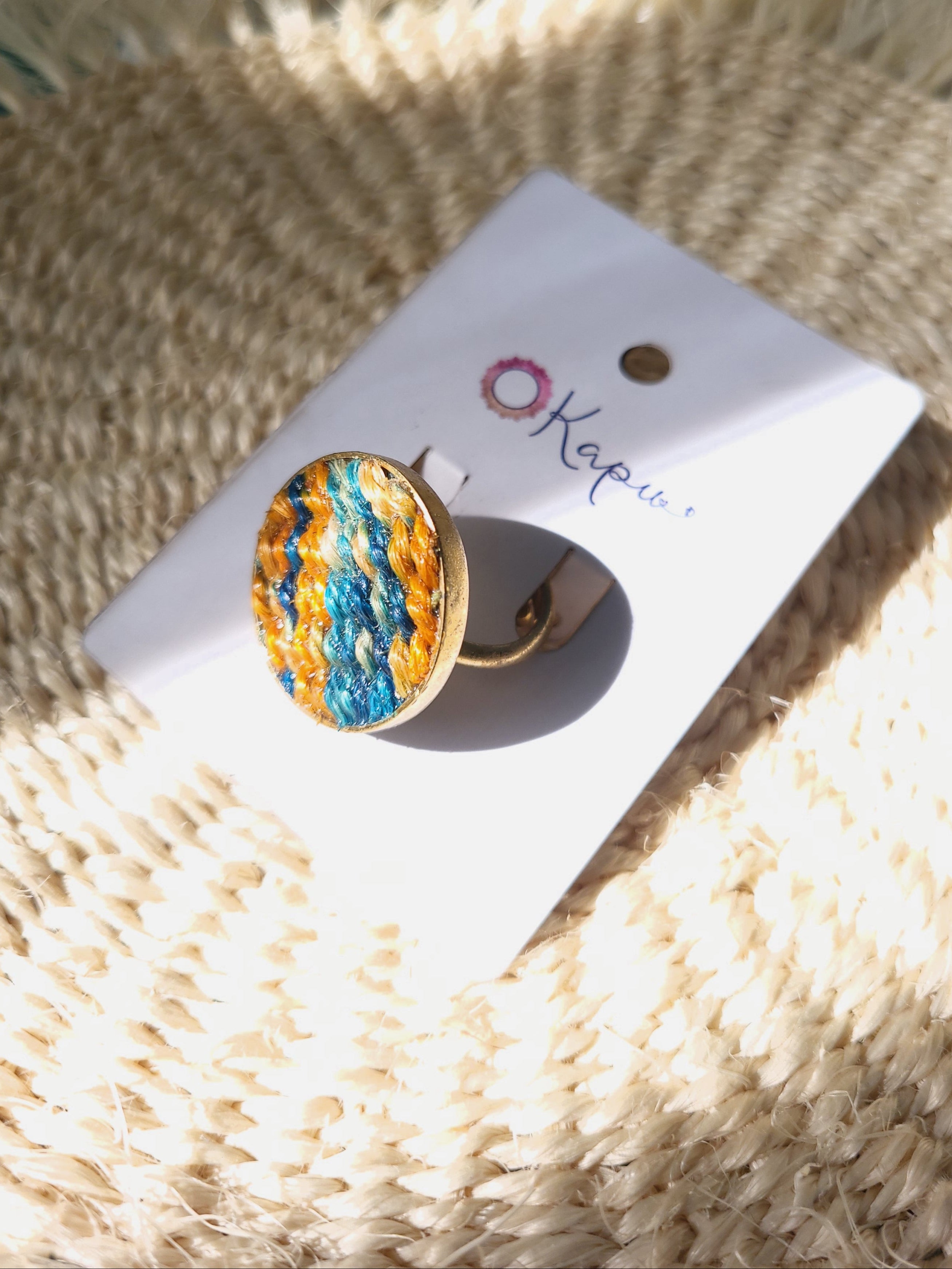 Nguru Ring in green and orange from Okapu’s Retrograde Collection, sustainable, handcrafted from upcycled materials.