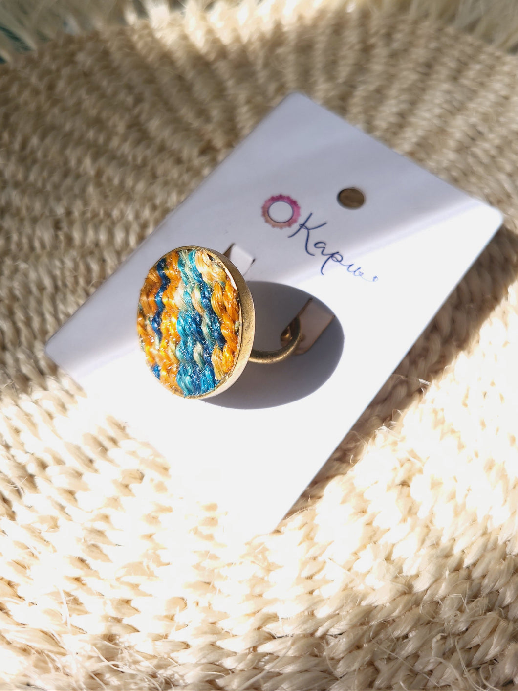 Nguru Ring in green and orange from Okapu’s Retrograde Collection, sustainable, handcrafted from upcycled materials.