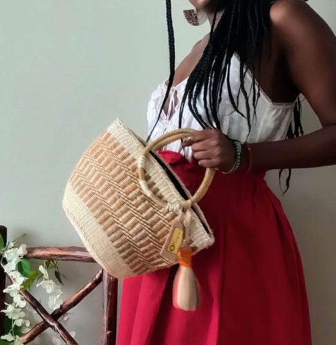 Neutral/ Nude top handle kiondo okapu with beaded round handles. Holiday or Vacation bag. Okapu is a social enterprise making kiondos great. African bags handmade in Kenya with love for gifts for women and to elevate their fashion style.